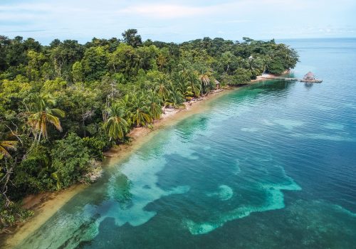 A beautiful view of an island with a jungle
